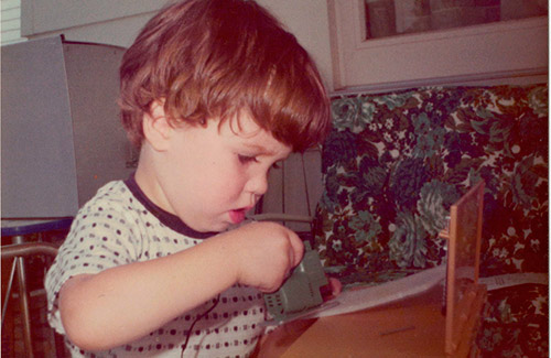 Little Joey intently cutting styrofoam with his jigsaw