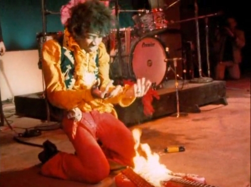 Jimi Hendrix burning a guitar